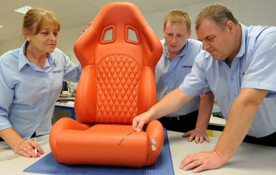 Training an apprentice in Penso's trim shop