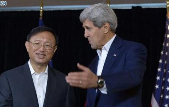 State Councillor Yang Jiechi (L) and US Secretary of State John Kerry speak to reporters prior to a meeting in Boston, Massachusetts, the United States, Oct 18, 2014 - image courtesy of News.cn
