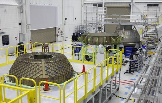 Parts of the Boeing CST-100 Structural Test Article rest on test stands inside NASA’s Kennedy Space Center in Florida. Image courtesy of NASA Kim Shiflett.