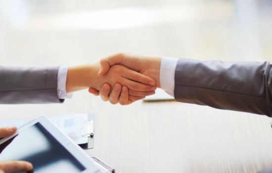 people shaking hands, finishing up a meeting - Dollarphotoclub_78997650