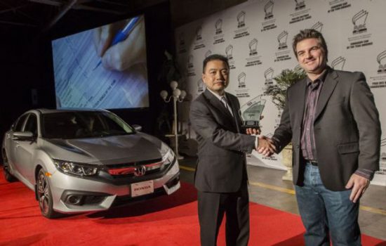 Hayato Mori, senior of product planning for Honda Canada, is presented with the award for the Best New Small Car category at the 2016 Canadian Car of the Year Awards
