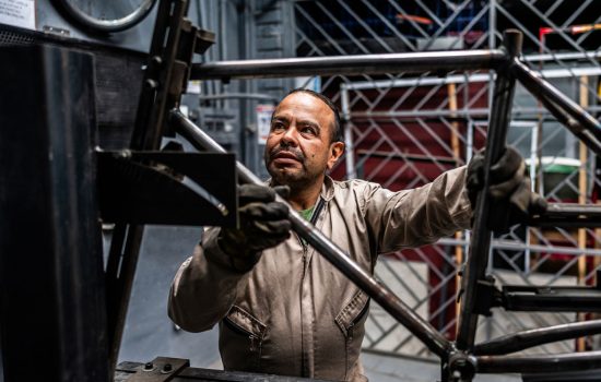 manufacturing or bicycle service technician using tablet or digital knowledge interface.