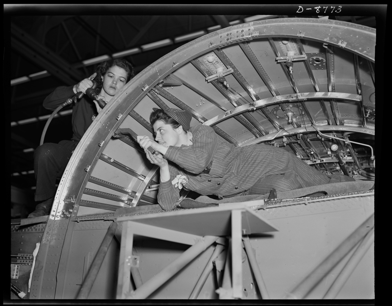 Women played a vital role in Detroit's wartime manufacturing effort, helping keep production lines running around the clock as factories shifted from automobiles to military equipment. Image credit: Howard R. Hollem / Library of Congress.